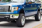 N-Fab stainless steel Wheel-to-Wheel nerf step bar installed on F-150 XLT