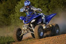 Man a on an ATV in all blue