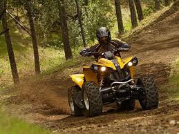 Man a on an ATV in all yellow