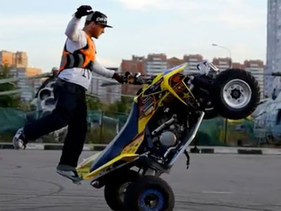 Guy doing stunts on an ATV