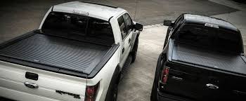 Black Chevy truck with a tonneau cover