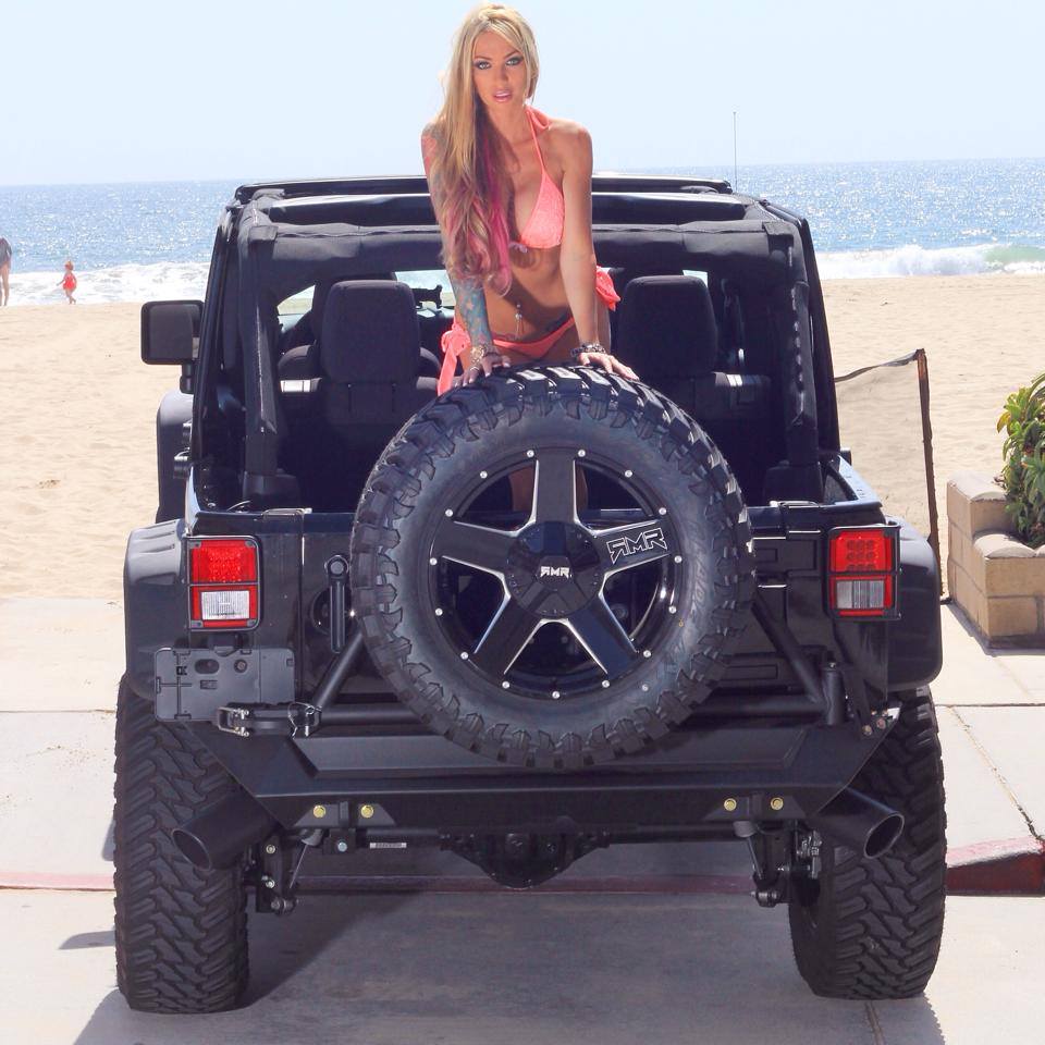 Good looking chick in the back of a jeep