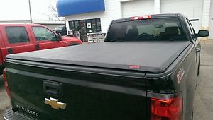 Black Chevy with tonneau cover