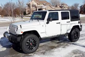 white jeep with Worx wheels
