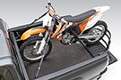 Amp Research BedXTender HD Moto in pickup's truck bed securing a motorcycle on a truck bed