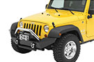 Stainless Bestop HighRock 4x4 Grille Guard on a yellow Jeep JK