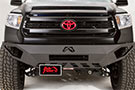 Fab Fours License Plate Bracket installed on Toyota pickup's front bumper