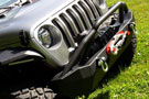 Angled view of Mid-Width Winch Front Bumper on a Jeep