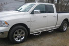 N-Fab stainless steel Wheel-to-Wheel nerf step bar on a white Dodge Ram