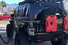 RotopaX 2-Gallon Gasoline Packs mounted on a Jeep's spare tire