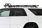 Vehicle with One-piece welded Flat Defender Cargo Rack