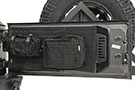 Black colored Smittybilt GEAR tail gate cover for Jeep