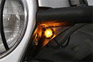 Illuminated Smittybilt XRC Flux Fender Flare Amber LED Light installed on a Jeep