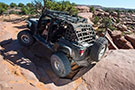 Off-roading with Jeep Wrangler featuring Smittybilt One Piece Defender Rack