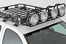 Smittybilt Defender Roof Rack Light Cage mounted on vehicle's roof top