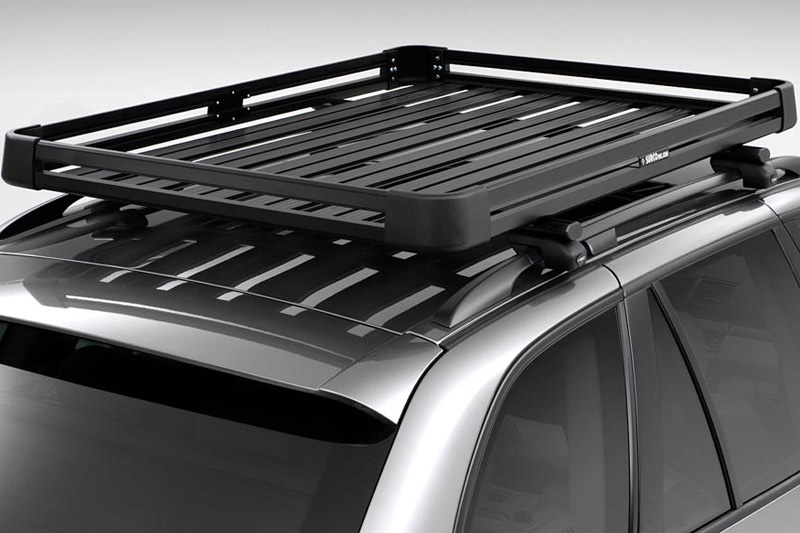 Black Surco Urban Roof Rack installed on vehicle's roof
