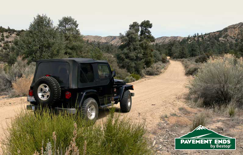 Pavement ends logo with a black jeep driving in the dessert