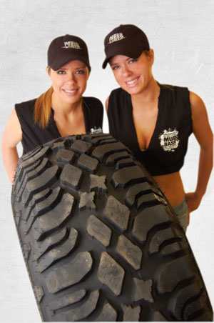 Pitbull tire girls behind a tire