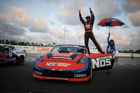 Chris stands on his NOS car after wining