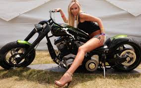 Great looking blonde sitting on a motorcycle