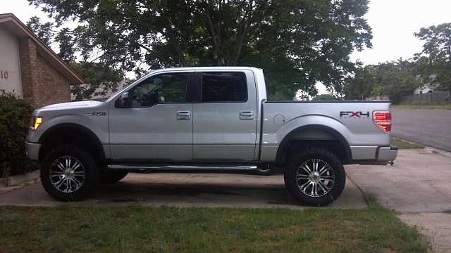 Silver Ford F-150 lifted