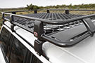 ARB Roof Rack Basket w/ Mesh floor installed on a vehicle's roof