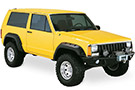 Cut-Out Fender Flares on a yellow Jeep Cherokee