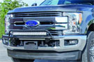 Textured black N-Fab Off-Road Light Bar installed on Ford's front bumper