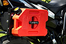RotopaX 1-Gallon Gasoline Pack mounted on a motorcycle's rear